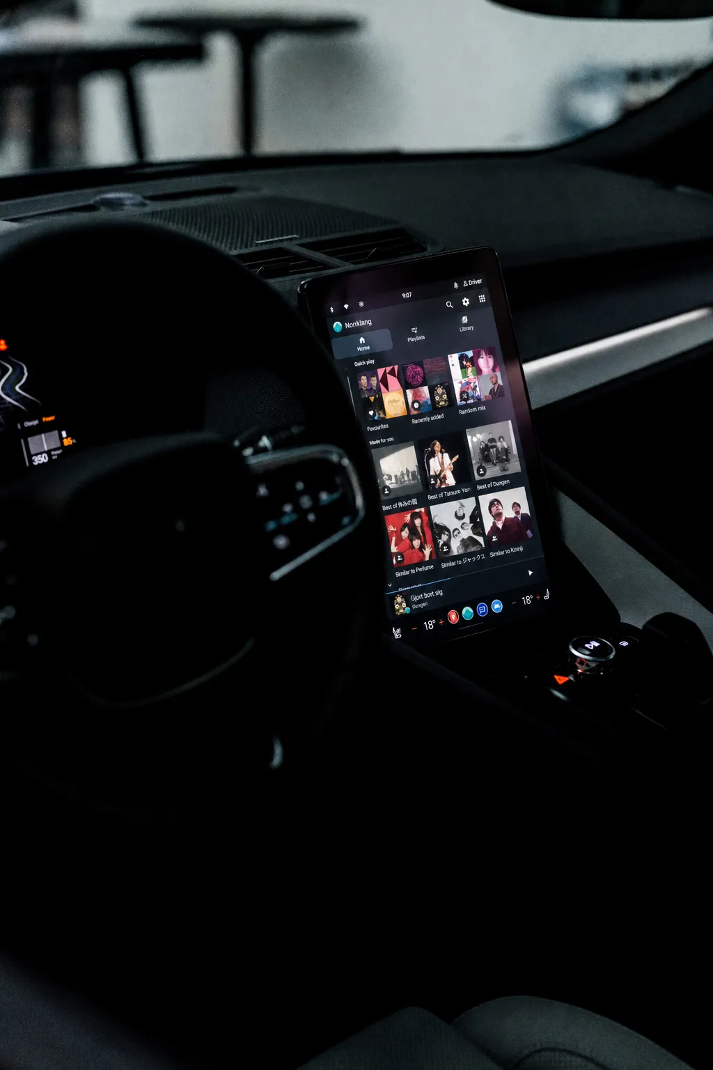 Norrklang’s album grid on the centre display of a Polestar 2, seen past the steering wheel